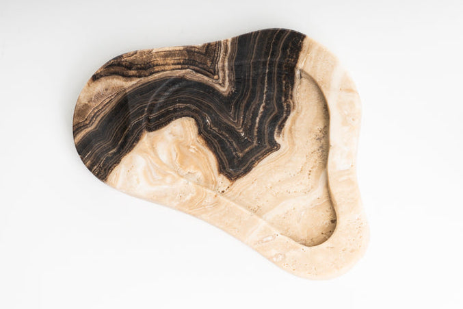 Onyx tray with black and brown patterns on a white background