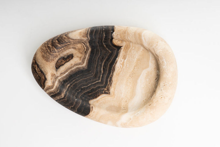 Onyx stone with black and beige patterns on a white background