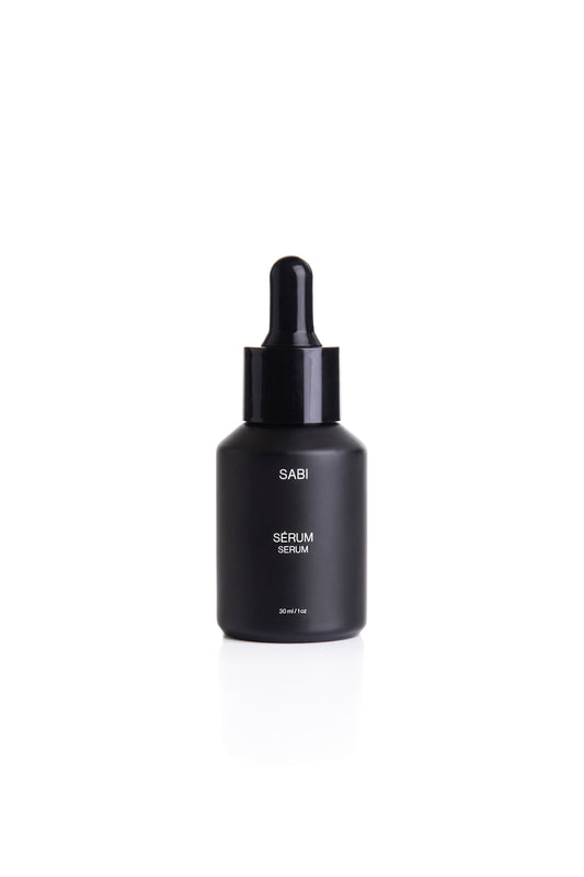 A black matte glass bottle with a dropper,  SABI Ritual Serum – high-performance vitamin-rich serum with 28 nutrient-dense botanicals, crafted to nourish, protect and revitalize radiant skin.