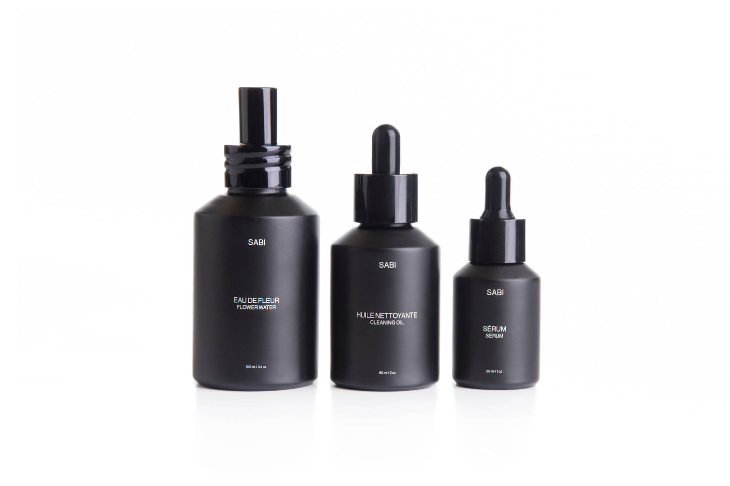 Complete SABI Botanical Ritual Trio – Cleansing Oil, Flower Water, and Ritual Serum set designed for a luxurious, 100% natural skincare ritual. Three black matte glass bottles with dropper caps. SABI Ritual Serum – high-performance vitamin-rich serum with 28 nutrient-dense botanicals, crafted to nourish, protect and revitalize radiant skin.
