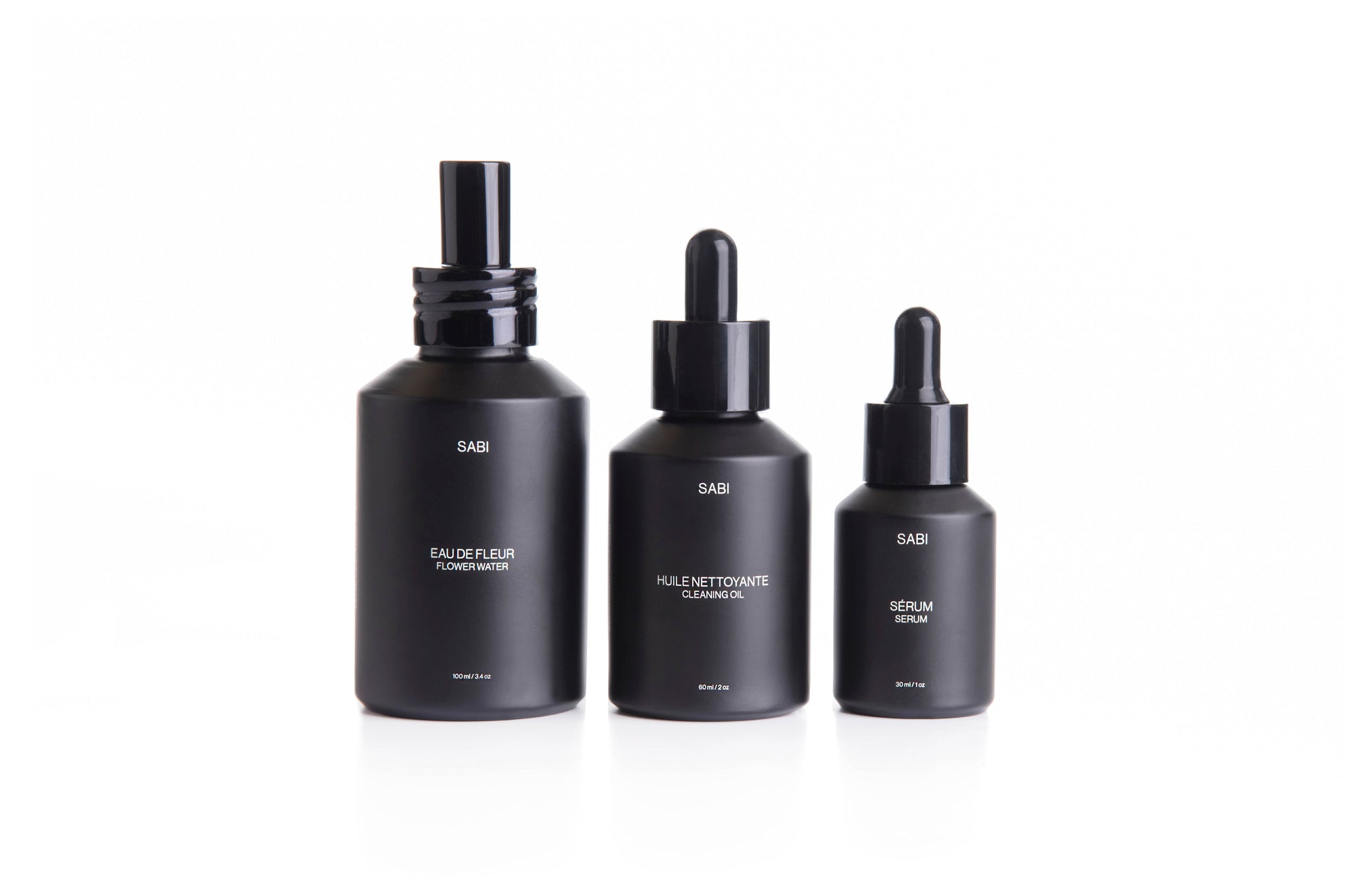 Complete SABI Botanical Ritual Trio – Cleansing Oil, Flower Water, and Ritual Serum set designed for a luxurious, 100% natural skincare ritual. Three black matte glass bottles with dropper caps. SABI Ritual Serum – high-performance vitamin-rich serum with 28 nutrient-dense botanicals, crafted to nourish, protect and revitalize radiant skin.